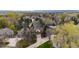 Wide aerial shot of property highlighting neighborhood, mature trees, and manicured lawns at 851 Racquet Ln, Boulder, CO 80303