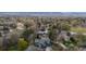 Wide aerial shot of property highlighting neighborhood, mature trees, and manicured lawns at 851 Racquet Ln, Boulder, CO 80303