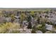 Wide aerial shot of property highlighting neighborhood, mature trees, and manicured lawns at 851 Racquet Ln, Boulder, CO 80303