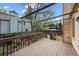 Spacious wood deck with overhead shade lattice, wood railing and stairs, overlooking the backyard garden at 851 Racquet Ln, Boulder, CO 80303