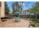 Beautiful backyard featuring a brick patio, mature trees, and outdoor furniture at 851 Racquet Ln, Boulder, CO 80303