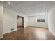 Finished basement rec room with wood flooring and recessed lighting at 851 Racquet Ln, Boulder, CO 80303