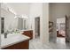 Elegant bathroom with dual vanities, marble floors, and a separate shower at 851 Racquet Ln, Boulder, CO 80303