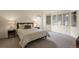 Bright bedroom with large windows, plush carpet, and neutral decor at 851 Racquet Ln, Boulder, CO 80303
