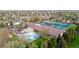 Enjoy access to community amenities including a pool and tennis courts with mature trees and views of the mountains at 851 Racquet Ln, Boulder, CO 80303