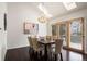 Elegant dining room featuring a chandelier, hardwood floors, and french doors, creating an inviting atmosphere for meals at 851 Racquet Ln, Boulder, CO 80303