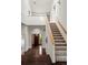 Bright foyer with hardwood floors, staircase, and natural light, offering a welcoming entrance to the home at 851 Racquet Ln, Boulder, CO 80303