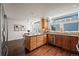 Spacious eat-in kitchen featuring wooden cabinets, granite countertops, and skylight at 851 Racquet Ln, Boulder, CO 80303