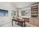 Bright office with vaulted ceiling, large windows, and custom built-in shelves at 851 Racquet Ln, Boulder, CO 80303