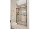 Updated shower with glass door, shower-head, and convenient grab bar at 851 Racquet Ln, Boulder, CO 80303