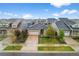Residential aerial view showing homes with mature trees, landscaping, driveways, and manicured lawns at 452 S Norfolk Ct, Aurora, CO 80017