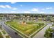Great aerial view of community park and playground with walking trails and new homes, ideal for Gathering living at 452 S Norfolk Ct, Aurora, CO 80017
