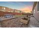 Picturesque backyard featuring a picnic table, green turf, wooden fence and thoughtful landscaping for serene outdoor living at 452 S Norfolk Ct, Aurora, CO 80017