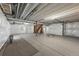 Unfinished basement boasts high ceilings and great space for storage or renovation at 452 S Norfolk Ct, Aurora, CO 80017