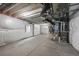 Spacious unfinished basement featuring utilities and ample storage at 452 S Norfolk Ct, Aurora, CO 80017