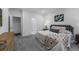 Bright bedroom features neutral decor, soft textures, and a comfy upholstered headboard at 452 S Norfolk Ct, Aurora, CO 80017