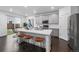 Gourmet kitchen with counter seating, stainless steel appliances, and modern finishes at 452 S Norfolk Ct, Aurora, CO 80017
