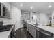 Gourmet kitchen with stainless steel appliances and center island with sink at 452 S Norfolk Ct, Aurora, CO 80017