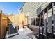 Cozy fenced backyard with an AC unit and access stairs, offering a private outdoor space at 5721 W 92Nd Ave # 96, Westminster, CO 80031