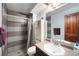 Bathroom featuring a shower-tub combo, vanity sink, and mirrored medicine cabinet for a functional space at 5721 W 92Nd Ave # 96, Westminster, CO 80031