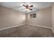 Bedroom featuring a ceiling fan with lights, neutral walls, and a window providing natural illumination at 5721 W 92Nd Ave # 96, Westminster, CO 80031