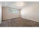 Neutral-toned bedroom with a window offering natural light and plush carpeting, perfect for comfort and relaxation at 5721 W 92Nd Ave # 96, Westminster, CO 80031