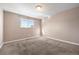 Serene bedroom features neutral walls, soft carpeting, and a window with natural light at 5721 W 92Nd Ave # 96, Westminster, CO 80031