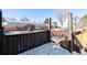 Exterior view from a snow-covered deck, showcasing the surrounding neighborhood and street at 5721 W 92Nd Ave # 96, Westminster, CO 80031