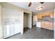 Practical kitchen layout showcasing laundry area, neutral cabinets, efficient appliances, and easy access to the laundry at 5721 W 92Nd Ave # 96, Westminster, CO 80031