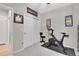 Brightly lit workout room featuring stationary bike and closet for easy storage at 239 Chipeta Way, Lochbuie, CO 80603