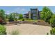 Backyard with a basketball court, tiered landscaping, and well-maintained lawn at 10826 Evergold Way, Highlands Ranch, CO 80126