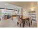 Open concept basement with dining, living, and entertainment areas, perfect for hosting at 10826 Evergold Way, Highlands Ranch, CO 80126