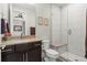 Modern bathroom with a glass-enclosed shower and a dark vanity at 10826 Evergold Way, Highlands Ranch, CO 80126