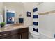 Bathroom with a blue and white shower curtain at 10826 Evergold Way, Highlands Ranch, CO 80126
