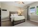Bedroom with window and neutral-colored walls at 10826 Evergold Way, Highlands Ranch, CO 80126