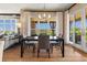 Elegant dining room with modern furnishings, stylish curtains, and access to the outdoor space at 10826 Evergold Way, Highlands Ranch, CO 80126