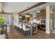 Spacious kitchen with a large island, granite countertops, stainless steel appliances, and ample seating at 10826 Evergold Way, Highlands Ranch, CO 80126