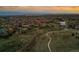 An aerial view shows the neighborhood, homes and the walking trail at 10826 Evergold Way, Highlands Ranch, CO 80126