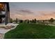 Beautiful backyard with a lush green lawn, landscaping, and an open view at 10826 Evergold Way, Highlands Ranch, CO 80126