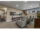 Finished basement featuring a home theater area and a vintage foosball table at 10826 Evergold Way, Highlands Ranch, CO 80126