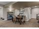 Finished basement features a dining area with a wooden table, shelving, and a stylish wet bar at 10826 Evergold Way, Highlands Ranch, CO 80126