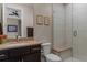 Bathroom features a tiled shower, modern fixtures, and neutral color palette at 10826 Evergold Way, Highlands Ranch, CO 80126