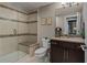 Bathroom with a tiled walk-in shower, modern vanity, and neutral decor at 10826 Evergold Way, Highlands Ranch, CO 80126