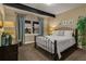 Bedroom features a comfortable bed, stylish lamps, and a window with a pleasant view at 10826 Evergold Way, Highlands Ranch, CO 80126