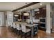Modern kitchen with granite countertops, stainless steel appliances, and a large central island at 10826 Evergold Way, Highlands Ranch, CO 80126