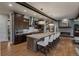 Gourmet kitchen with a large island, stainless steel appliances, and a cozy fireplace nearby at 10826 Evergold Way, Highlands Ranch, CO 80126