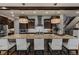 Spacious kitchen island featuring a granite countertop and stylish pendant lighting at 10826 Evergold Way, Highlands Ranch, CO 80126