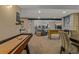 Open living space with a cozy seating area, fireplace, games and plenty of room for entertainment at 10826 Evergold Way, Highlands Ranch, CO 80126