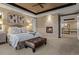 Elegant main bedroom features tray ceiling, fireplace, and access to bathroom at 10826 Evergold Way, Highlands Ranch, CO 80126