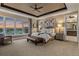 Spacious main bedroom with decorative ceiling, hardwood floors, and stunning view at 10826 Evergold Way, Highlands Ranch, CO 80126